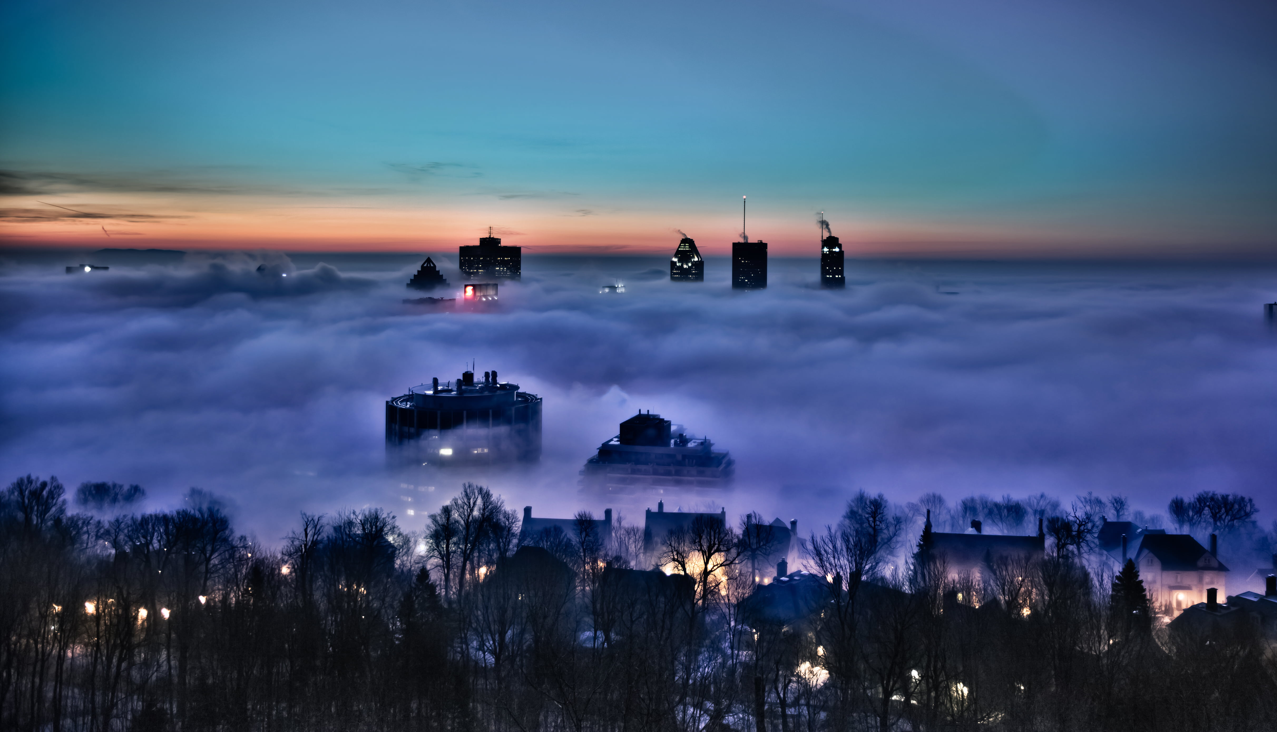 aerial photography of city covered in fog