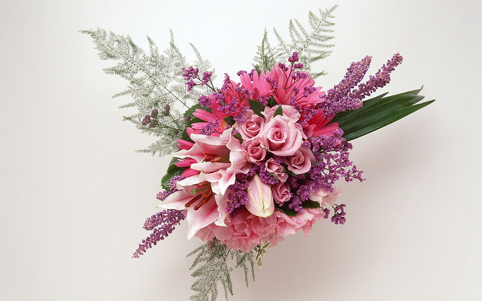 pink and purple corsage in front of white wall HD wallpaper