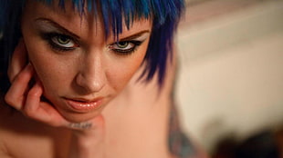 woman with blue hair in shallow focus photography