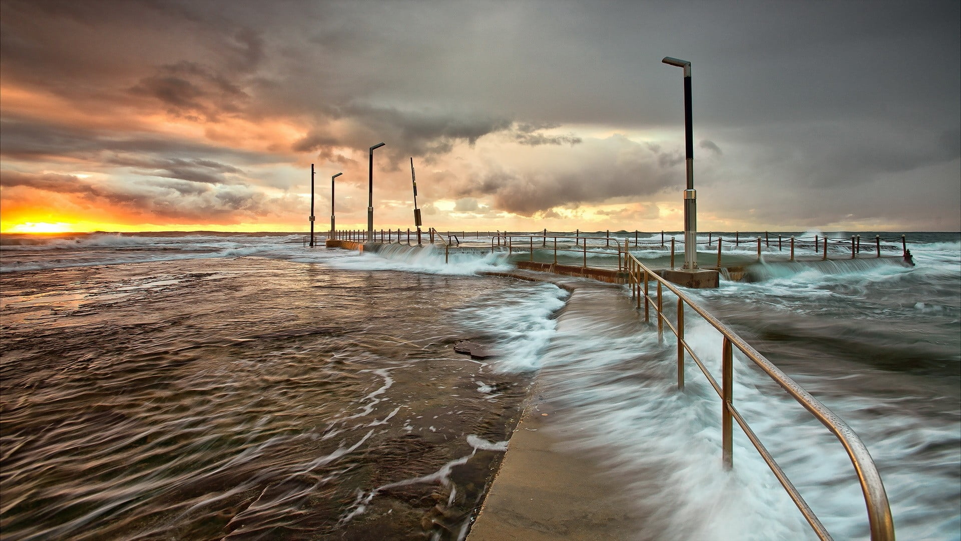 time-lapse photography of sea waves on walkway