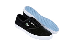 pair of black-and-white Lacoste low-top sneakers