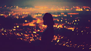 silhouette of person with light bokeh background