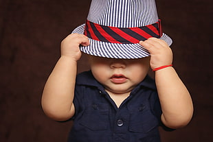 baby in black shirt and cowboy hat HD wallpaper