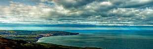 aerial photography of body of water and land under white cloudy skies, ravenscar HD wallpaper