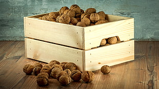 photography of brown wooden crates filled of brown shell lot