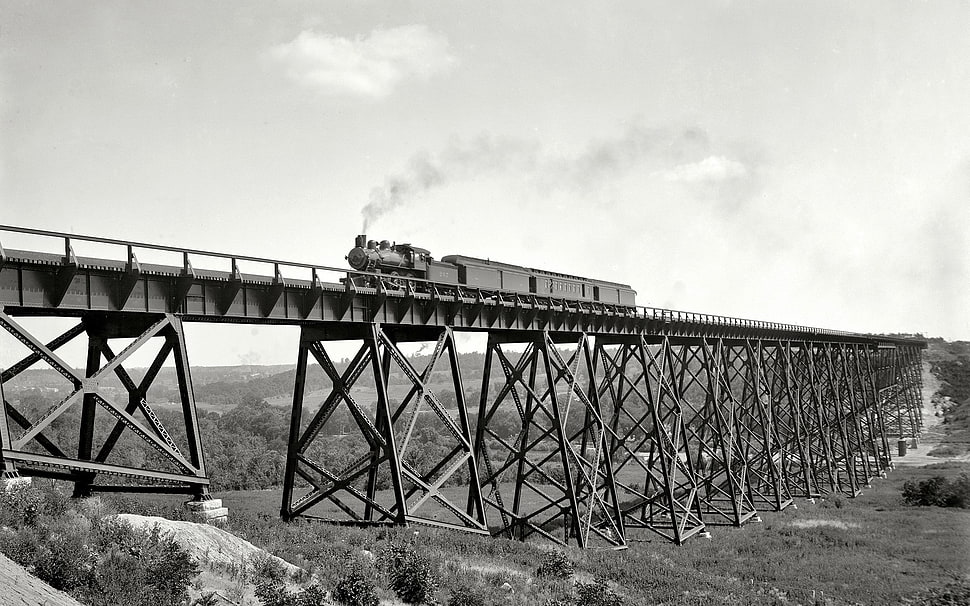 grayscale photo of train and bridge rails HD wallpaper