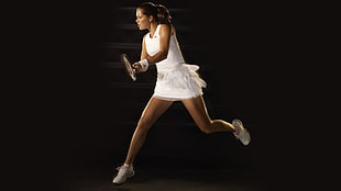 woman in white sleeveless dress holding lawn tennis racket