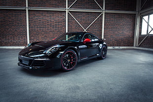 black Porsche coupe photo