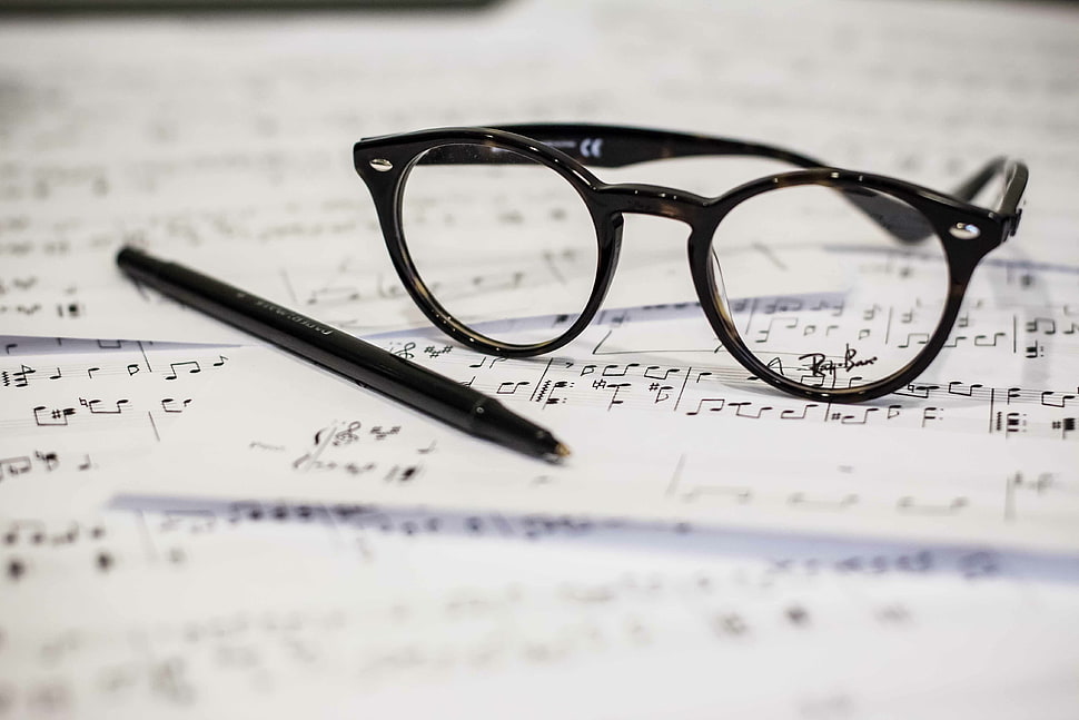 black framed eyeglasses beside black pen HD wallpaper