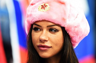 photo of woman in pink fur hat