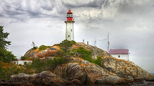 white and orange lighthouse tower, lighthouse, rock, clouds, Point Atkinson Lighthouse