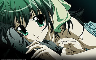photo of girl in green hair lying on gray pillow anime character