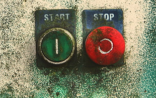 two green and red push buttons, power buttons, start, stop, wall