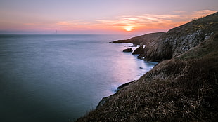 bird's eyeview of cliff and sunset, howth, dublin, ireland HD wallpaper