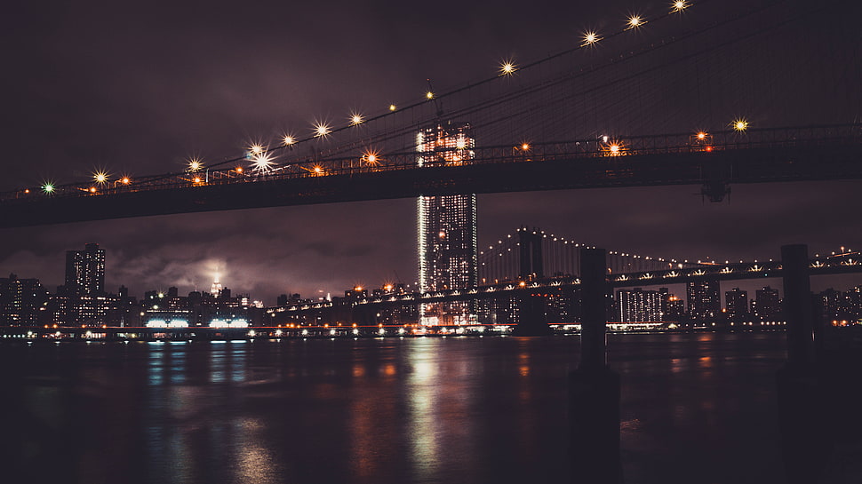 lighted Brooklyn Bridge at night HD wallpaper