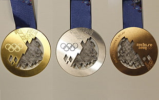 three silver and gold medals