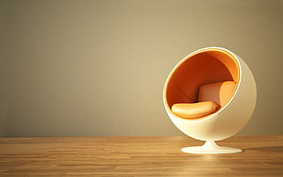 white and orange egg chair
