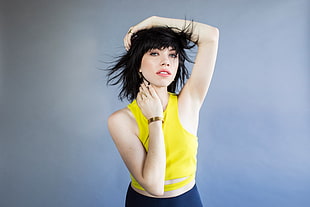 woman wearing yellow sleeveless top