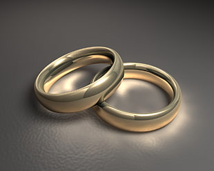 two silver-colored wedding rings