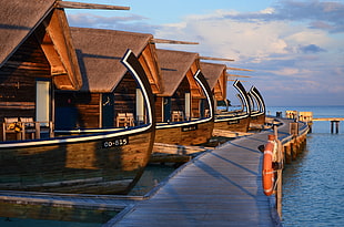 brown boat near body of water HD wallpaper