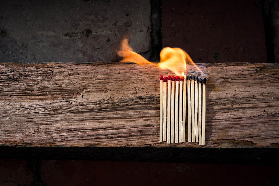 time lapse photo of matchsticks on fire on wooden board HD wallpaper