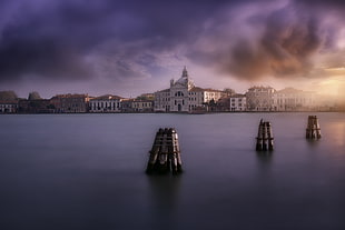 landscape photography of body of water and white buildings, venetian