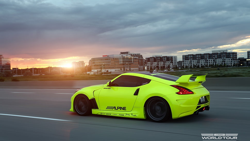 green Nissan 370z on road during golden hour HD wallpaper