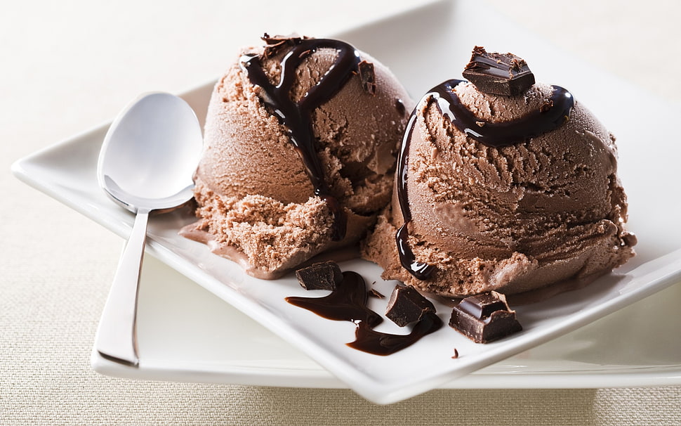 two brown chocolates with stainless steel spoon HD wallpaper