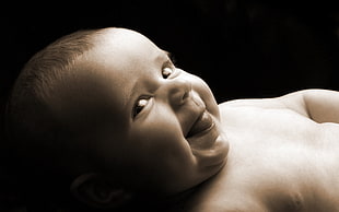 high angle photo of smiling baby
