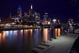city buildings photo under the black sky during nightime, melbourne