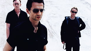 man in black button-up shirt wearing black aviator sunglasses