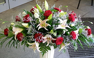 red Rose flowers and white lily flowers centerpiece