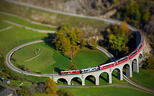 red train on track miniature HD wallpaper