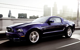 blue Ford Mustang on road