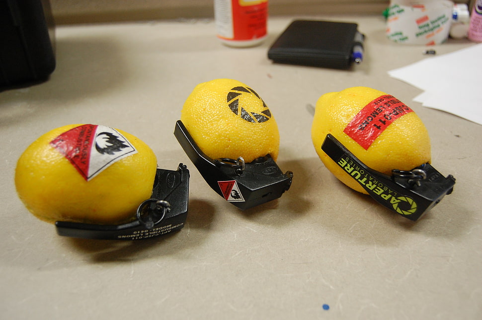 three yellow-and-black frag grenades, video games, Portal (game), Portal 2, Valve HD wallpaper