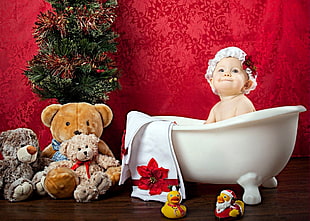 toddler in white ceramic tub
