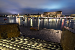 cityscape photo of low-rise and high-rise concrete buildings during nigh time, sweden