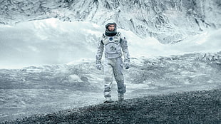 astronaut walking on gray surface