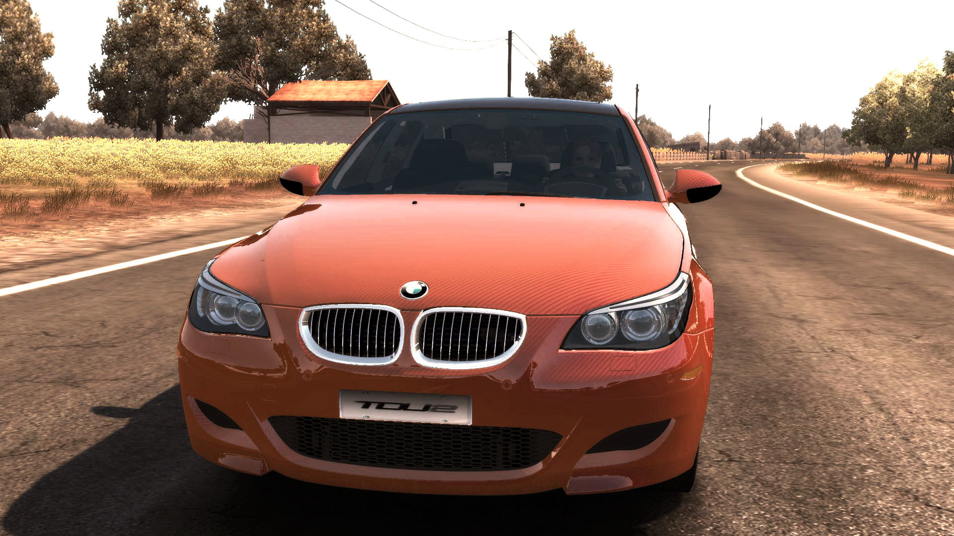orange BMW caron road