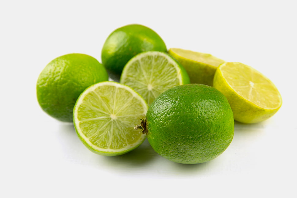 sliced calamansi fruits HD wallpaper