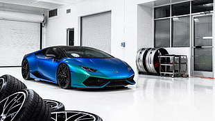 blue Lamborghini Aventador inside white garage