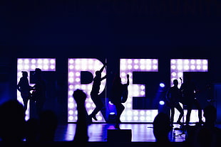 group of people dancing on stage