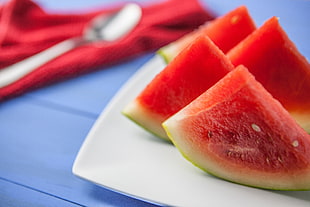 watermelon slices with white ceramic plate