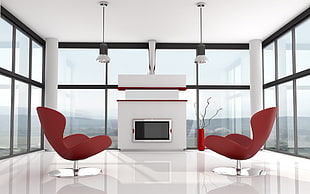 gray flat screen mounted television and two red plated swivel chairs