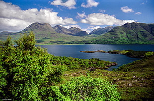 photography of mountain near body of water during daytime, scotland