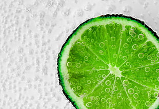 close up view of green sliced lemon