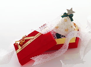 red and yellow Merry Christmas gift box