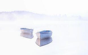 two grey boat on of body of water