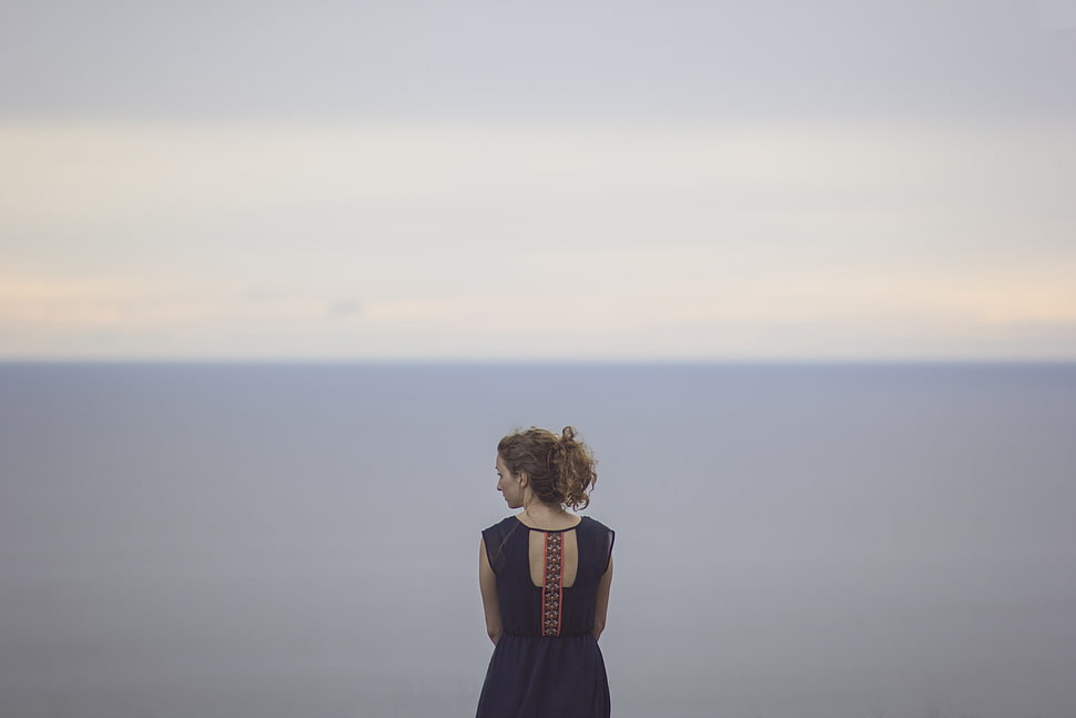 woman standing near sea HD wallpaper