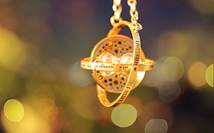 gold-colored globe rings pendant necklace